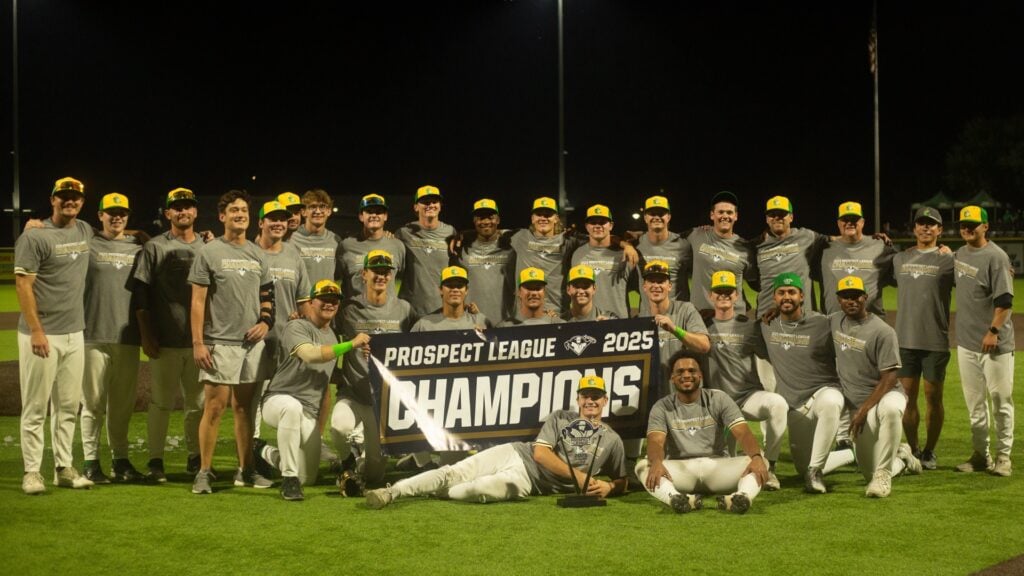 Baseball team celebrates winning Prospect League 2025 Champions title with a banner and trophy.